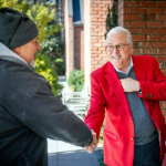 Chancellor Randy Woodson shakes a man hand.